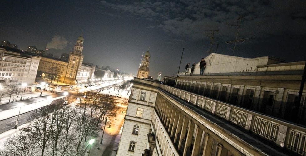 Just — Graffiti writers on a Berlin rooftop at night